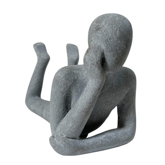 LYING MAN STATUE